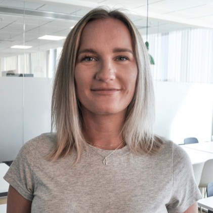 Black and white close-up portrait of a man in a suit.